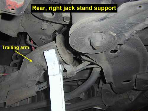 Jack stand under trailing arm; rear 2